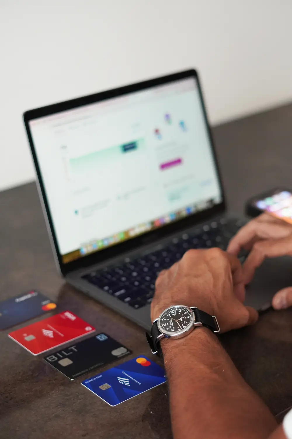 Building an organized business foundation with Valyon Business owner organizing company financial documentation on a laptop